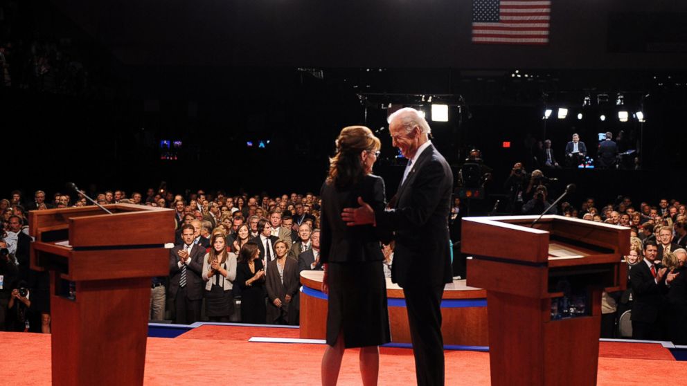 Republican Vice Presidential candidate, Alaska Gov. Sarah Palin, left, and Democratic Vice Presidential candidate, Sen Joe Biden, D-Del., talk with each other after their vice presidential debate, Oct. 2, 2008, in St. Louis, Missouri.