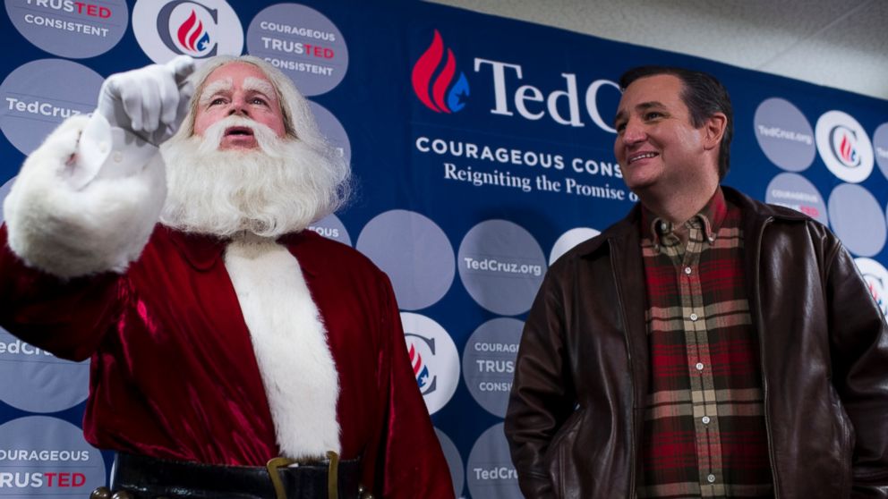Santa Claus makes an appearance with Republican Presidential candidate Sen. Ted Cruz, R-Texas, during his media availability before the rally at the Life Church in Mechanicsville, Va., on Dec. 17, 2015. 
