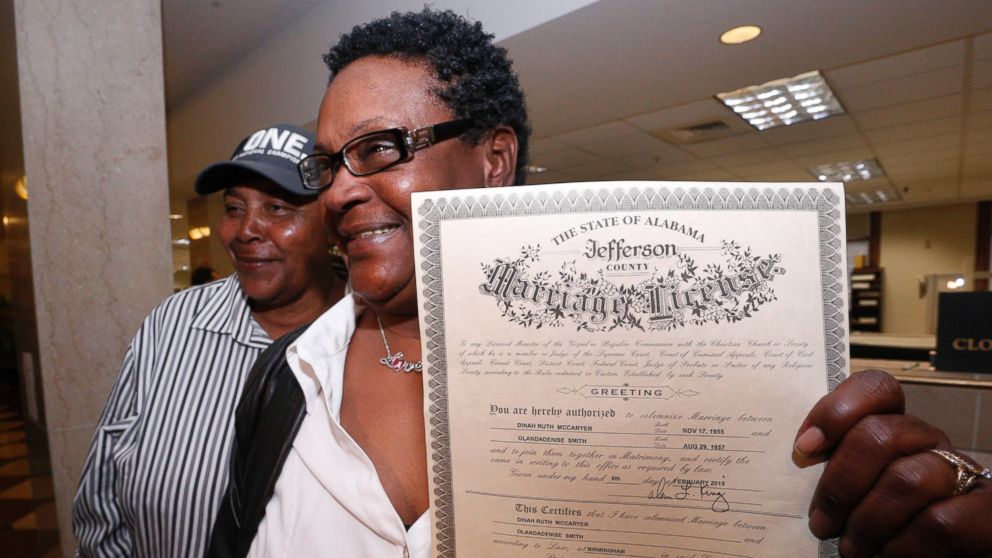 Olanda Smith, left, and Dinah McCaryer show off their certificate after being the first to be married at the Jefferson county courthouse, Monday, Feb. 9, 2015, in Birmingham, Ala. 