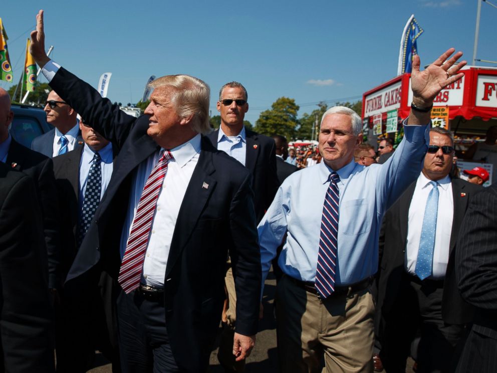 PHOTO:Republican presidential candidate Donald Trump, center left, waves as he walks with vice presidential candidate Gov. Mike Pence, R-Ind., center right, during a visit to the Canfield Fair, Sept. 5, 2016, in Canfield, Ohio.
