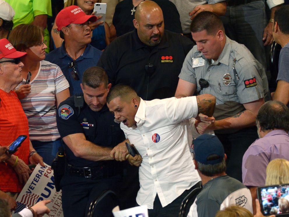 PHOTO: A protester is escorted out of the Albuquerque Convention Center during a rally for Republican presidential candidate Donald Trump, May 24, 2016, in Albuquerque.
