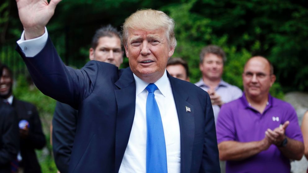 In this Tuesday, June 30, 2015 photo, Republican presidential candidate Donald Trump waves as he arrives at a house party in Bedford, N.H. Alex Nogales, president of the National Hispanic Media Coalition, said Thursday, July 9, 2015, that more organizations need to follow the example of NBC and cut business ties with Trump.