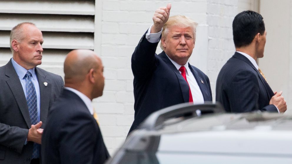 Republican presidential candidate Donald Trump waves as he arrives for a meeting with House Speaker Paul Ryan of Wis., at the Republican National Committee Headquarters on Capitol Hill in Washington, May 12, 2016.