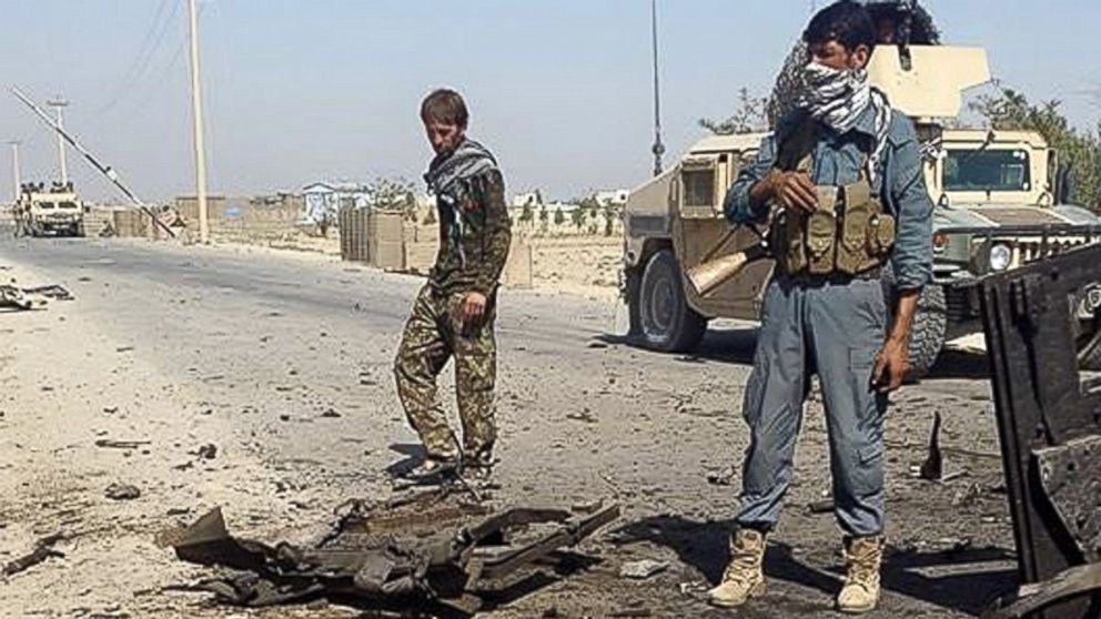 Afghanistan's security forces inspect the site of a U.S. airstrike, in Kunduz city, north of Kabul, Afghanistan, Oct. 1, 2015. 