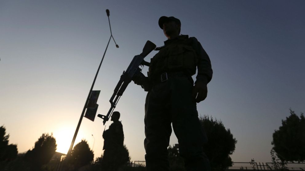 Afghan security forces stand guard after an attack on the American University of Afghanistan in Kabul, Afghanistan, Aug. 25, 2016.