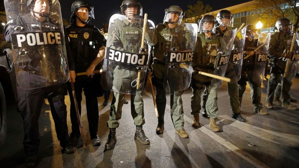 Police stand in formation as a curfew approaches in Baltimore, in this April 29, 2015 file photo. 