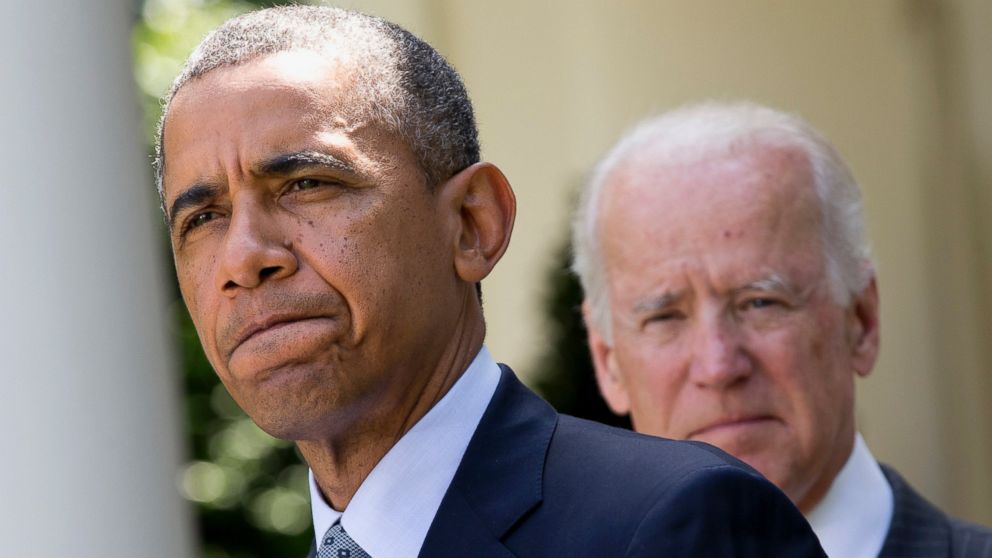 President Barack Obama, accompanied by Vice President Joe Biden, pauses while making an announcement about immigration reform in the Rose Garden of the White House in Washington, June 30, 2014. 