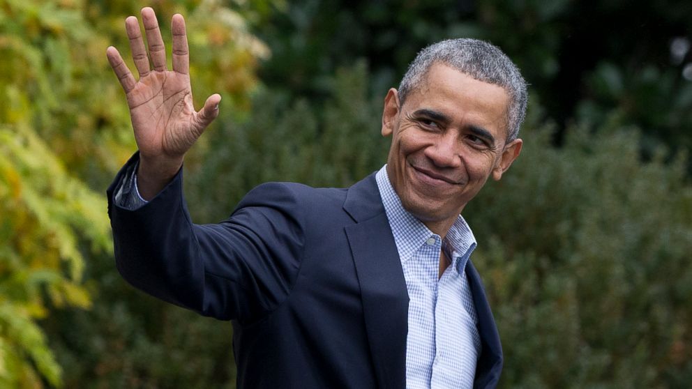 President Barack Obama waves as he walks across the South Lawn of the White House to board Marine One, Nov. 29, 2015, in Washington.