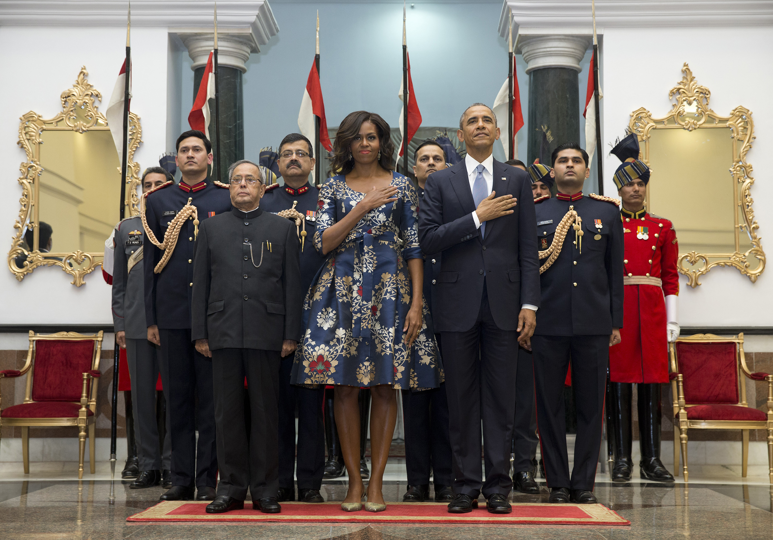 PHOTO: President Barack Obama, right, first lady Michelle Obama, center, and Indian President Pranab Mukherjee, left, stand during the US National Anthem at the State Dinner at the Rashtrapati Bhavan, in New Delhi, India, Sunday, Jan. 25, 2015. 