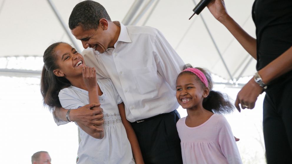 PHOTO: Then-Democratic presidential hopeful, Sen. Barack Obama, D-Ill., stands with his two daughters, Malia, left, and Sasha, as he is introduced by his wife Michelle, right, at Headwaters Park in Fort Wayne, Ind., May 4, 2008. 