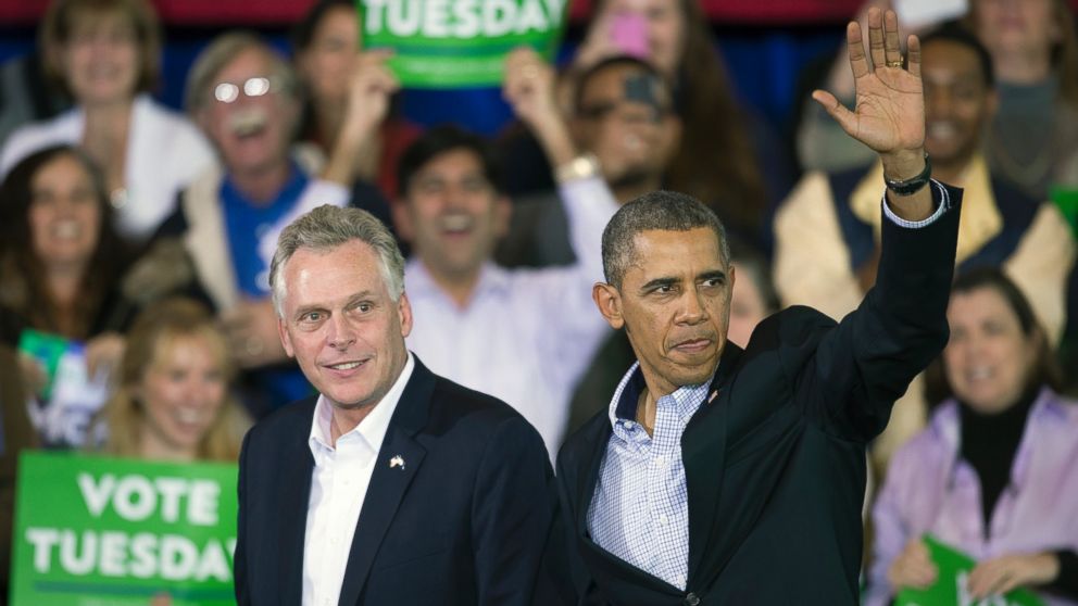 President Barack Obama appears at a campaign rally with supporters for Virginia Democratic gubernatorial candidate Terry McAuliffe, left, at Washington Lee High School in Arlington, Va., Sunday, Nov. 3, 2013. 