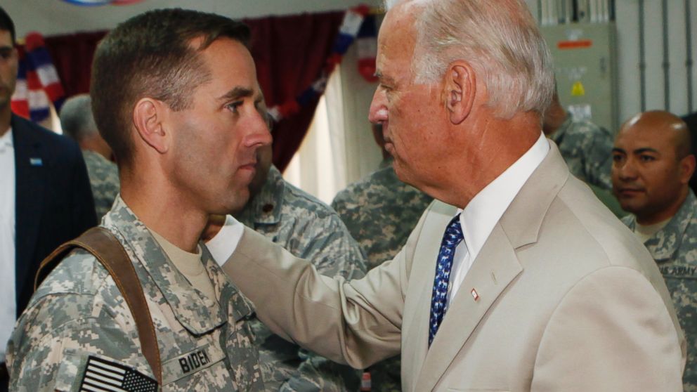 Vice President Joe Biden, right, talks with his son, U.S. Army Capt. Beau Biden, at Camp Victory on the outskirts of Baghdad, Iraq, July 4, 2009. 