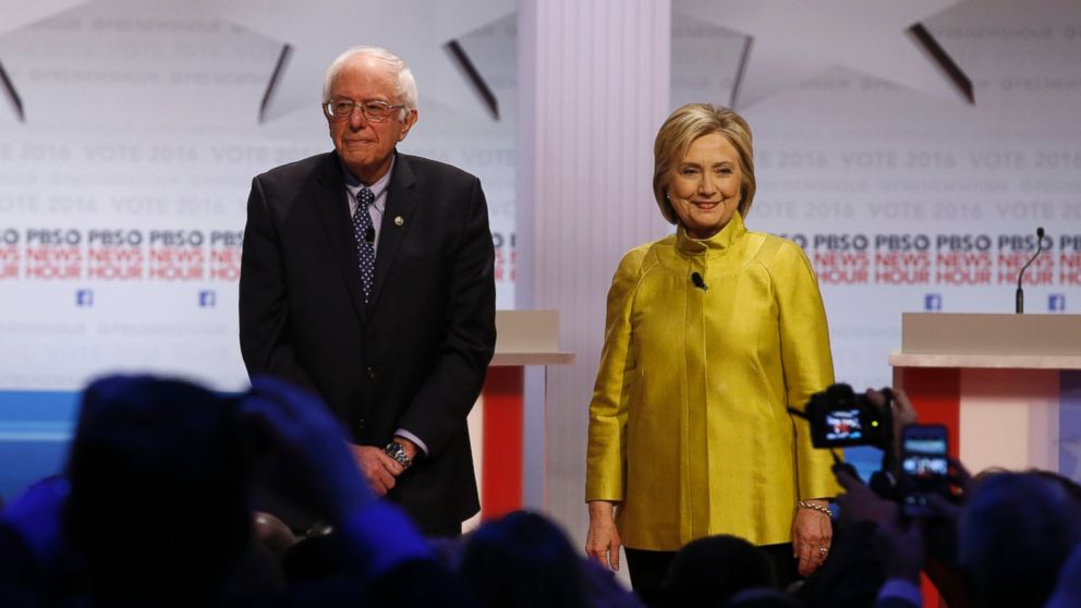 Democratic presidential candidates Sen. Bernie Sanders, I-Vt, left, and Hillary Clinton take the stage before a Democratic presidential primary debate at the University of Wisconsin-Milwaukee, Feb. 12, 2016, in Milwaukee.