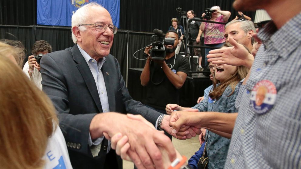 Democratic presidential candidate, Sen. Bernie Sanders shakes hands with supporters after speaking at a political rally in Madison, Wis., July 1, 2015.