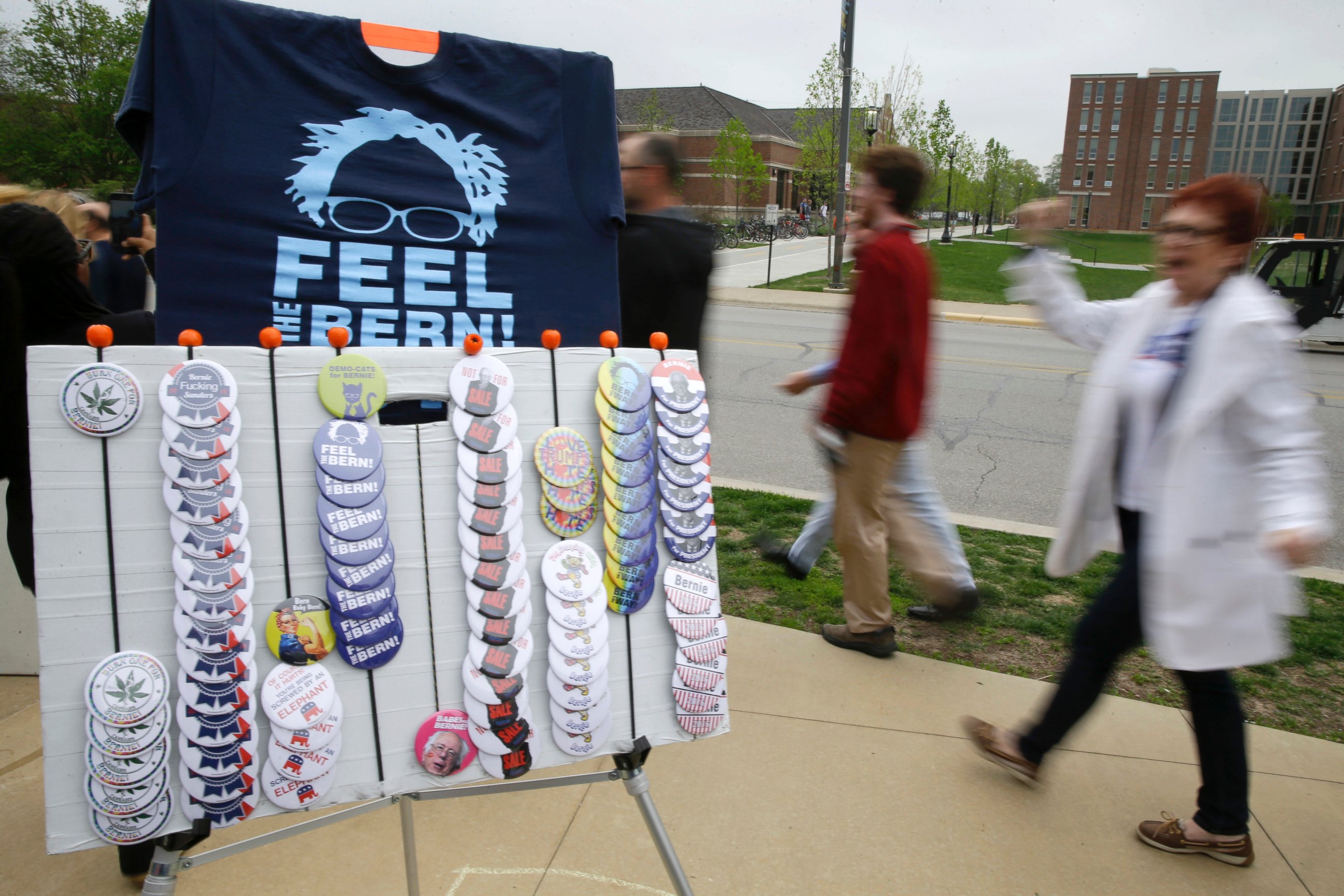 PHOTO: T-shirts and button are sold along the line of supports waiting to enter a rally for Democratic presidential candidate Sen. Bernie Sanders, I-Vt., April 27, 2016, at Purdue University in West Lafayette, Ind. 