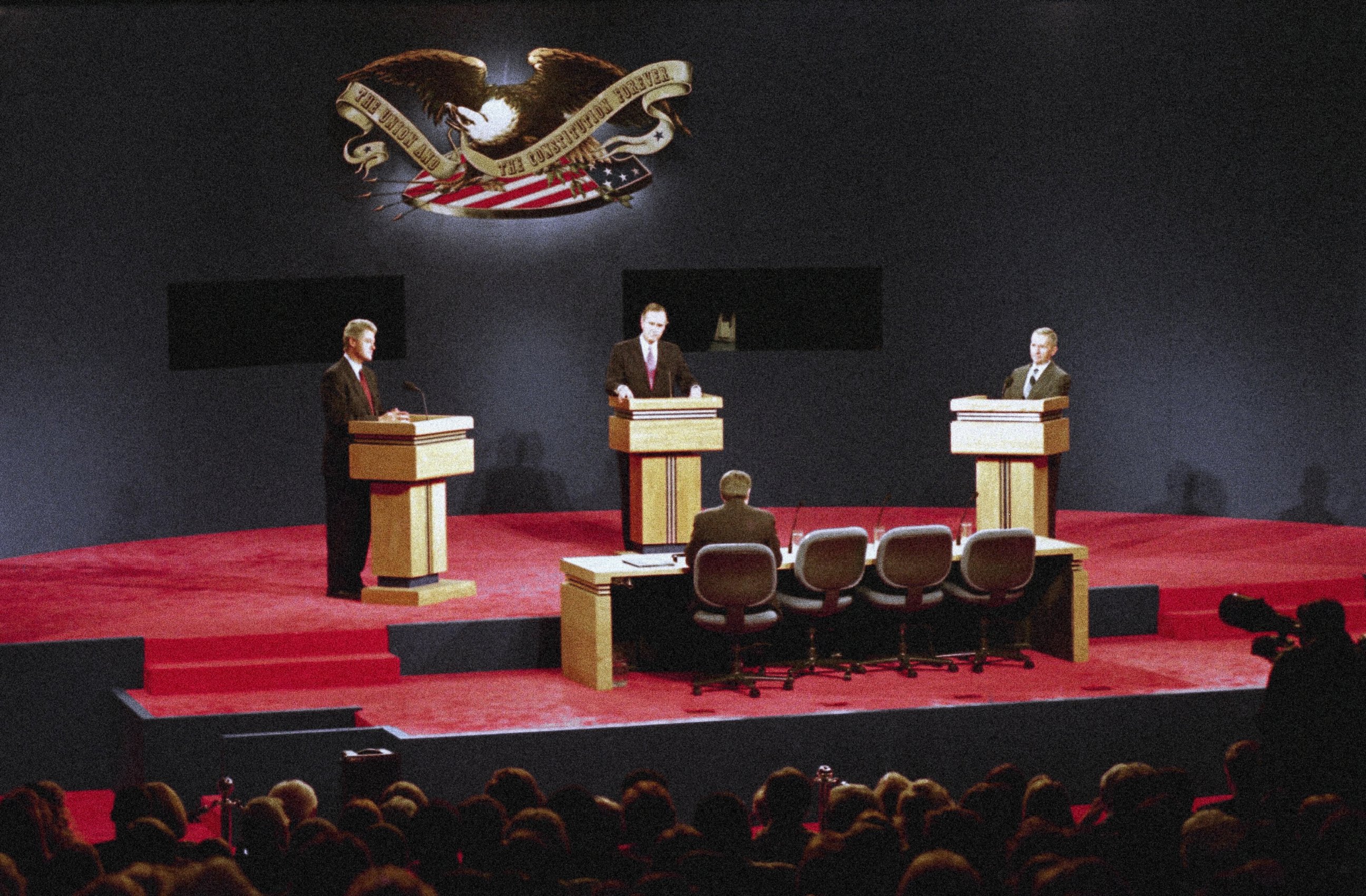 PHOTO: Presidential candidates Gov. Bill Clinton, left, President George Bush, center, and Ross Perot, right, face-off in their third and final presidential debate in East Lansing, Michigan, Oct. 19, 1992. 