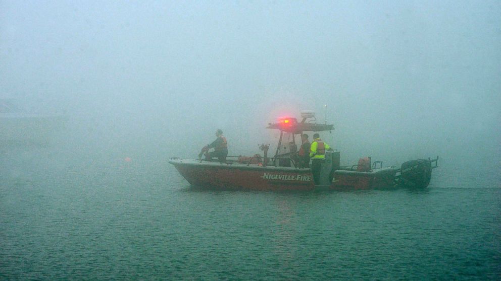 PHOTO: A search boat from the Niceville Fire Department is shrouded in fog as rescue workers search a site near Navarre Beach, Fla., March 11, 2015, where an Army Black Hawk helicopter crashed.