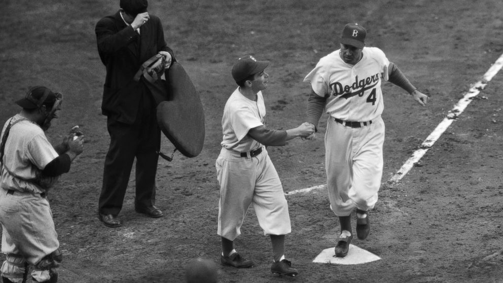 PHOTO: Brooklyn Dodgers' Duke Snider is greeted by the batboy on his second homer of Game 6 of baseball's World Series against the New York Yankees at Ebbets Field in Brooklyn, New York, Oct. 6, 1952.  
