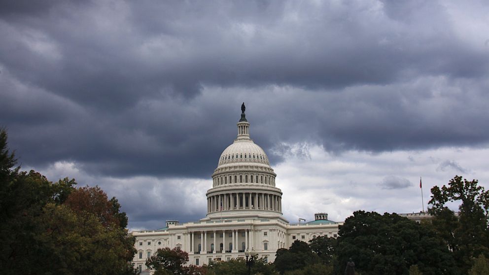 Dark clouds hang over the U.S. Capitol in Washington on Saturday, Sept. 28, 2013.