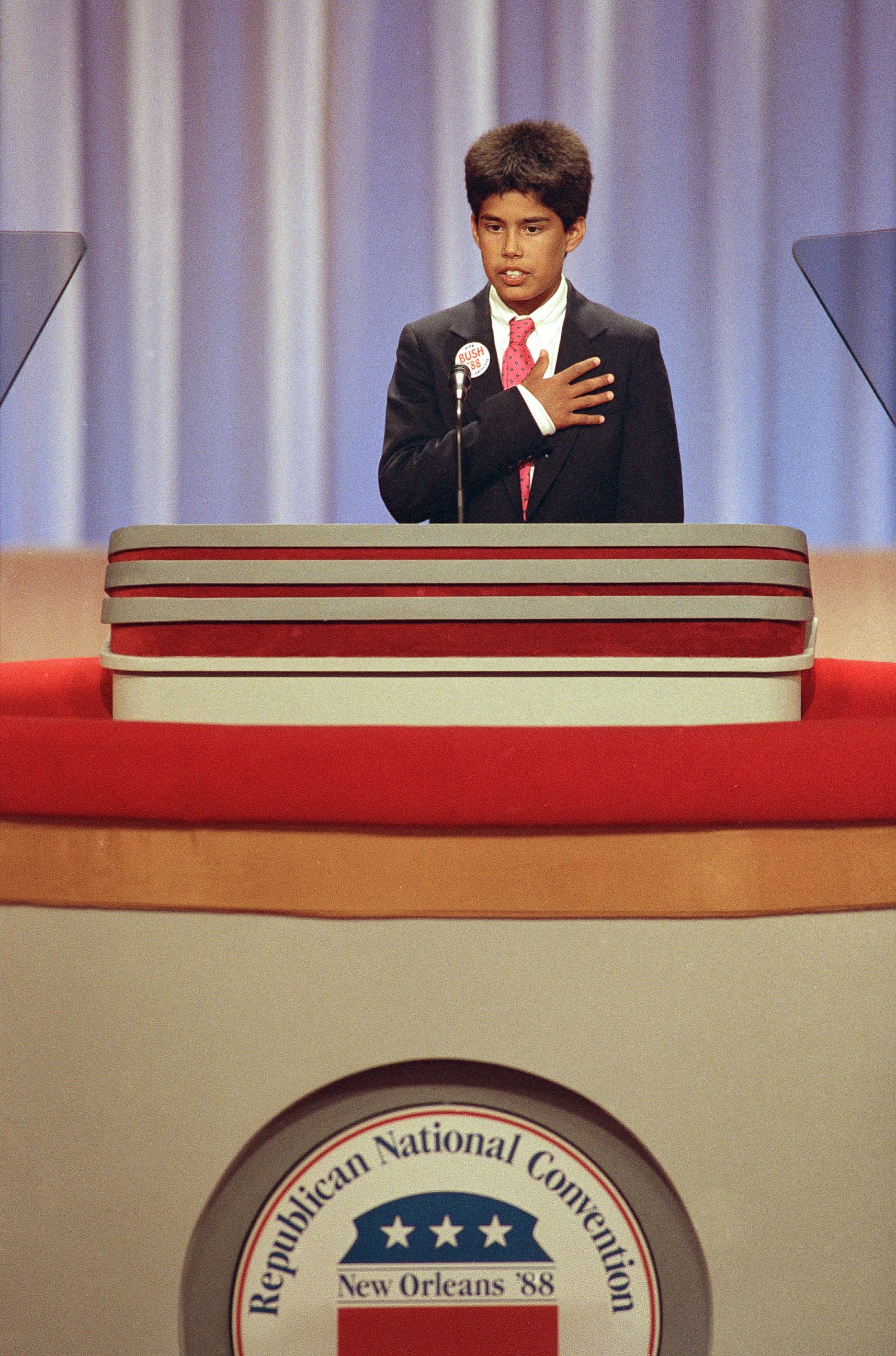 PHOTO: George P. Bush, grandson of George H.W. Bush, leads the Pledge of Allegiance at the opening session of the Republican National Convention in New Orleans, La. on Aug. 16, 1988. 