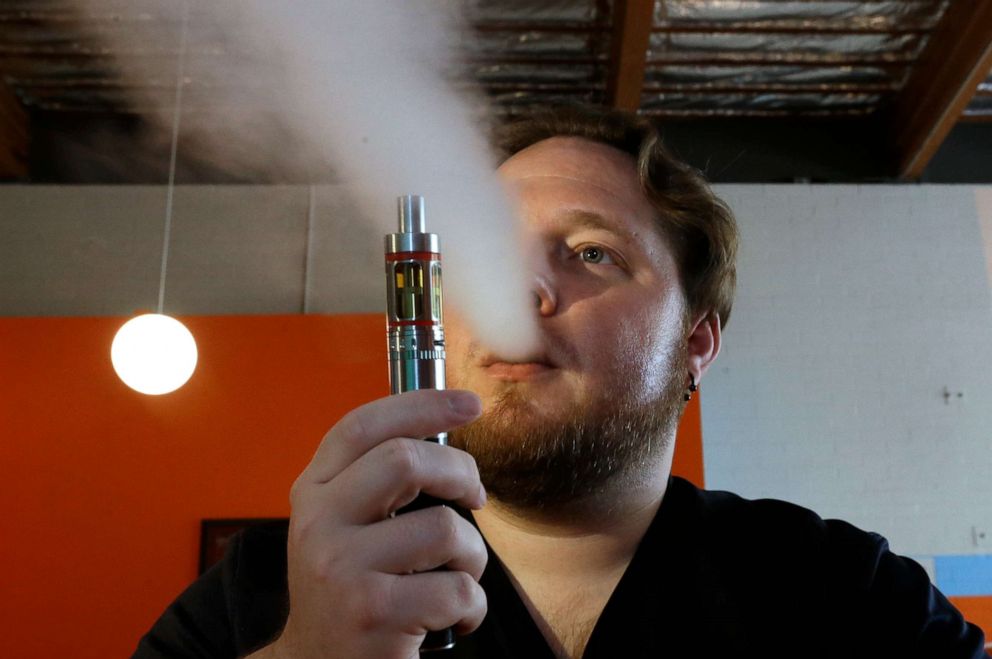 PHOTO: In this July 16, 2015 file photo, Bruce Schillin exhales vapor from an e-cigarette at the Vapor Spot, in Sacramento, California.