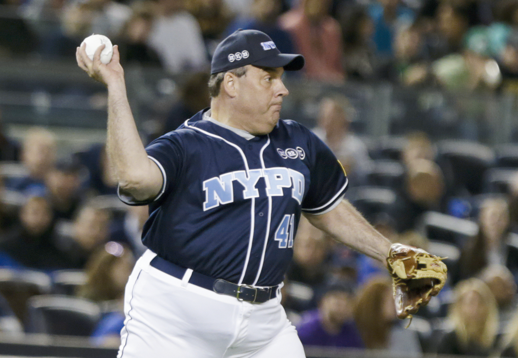 PHOTO: New Jersey Gov. Chris Christie throws to second base during the first inning of the "True Blue" benefit celebrity softball game at Yankee Stadium, June 3, 2015, in New York.