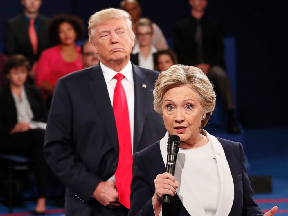 PHOTO: Democratic presidential nominee Hillary Clinton speaks as Republican presidential nominee Donald Trump listens during the second presidential debate at Washington University in St. Louis, Oct. 9, 2016.