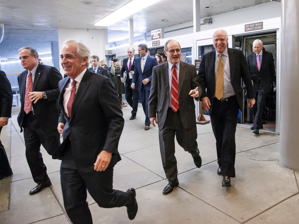 PHOTO: Senators rush to the floor for a procedural vote to advance the $585 billion defense bill at the Capitol in Washington, Dec. 11, 2014.