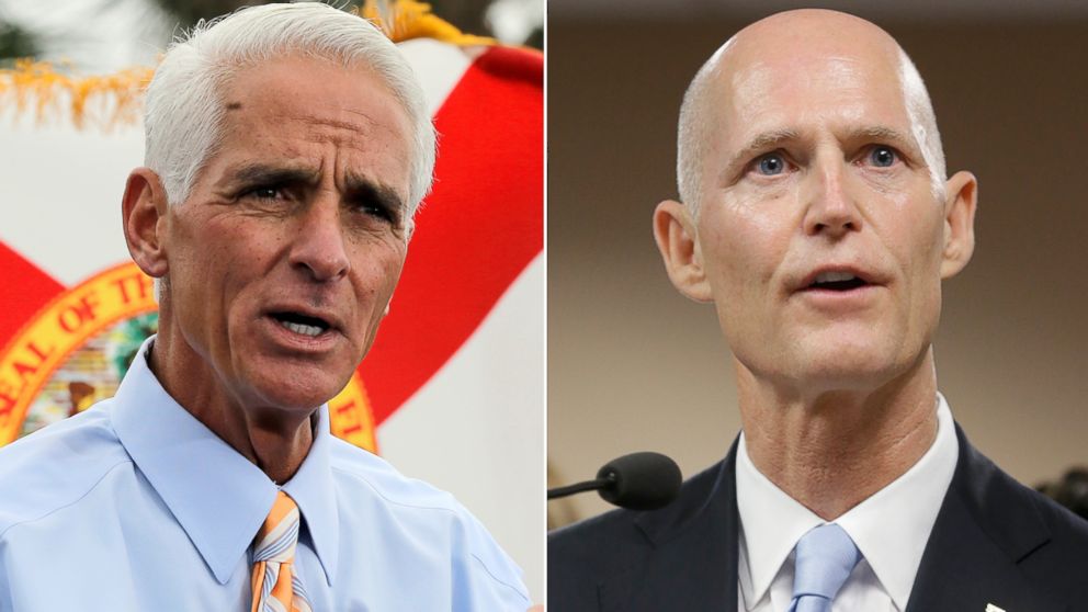 From left, former Florida Governor Charlie Crist in St. Petersburg, Fla., Nov. 4, 2013 and Governor Rick Scott in Miami, Jan. 14, 2014.