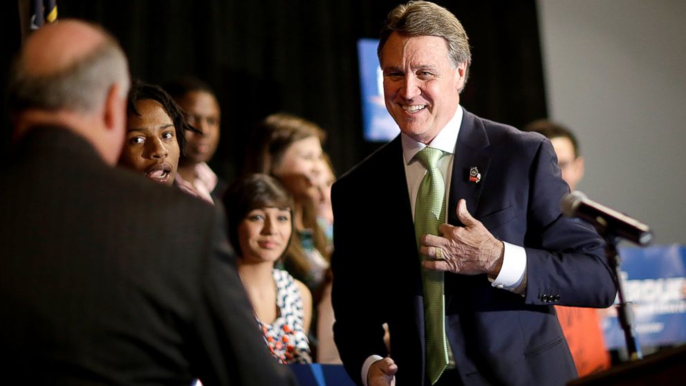 Georgia Republican Senate candidate, David Perdue, right, greets supporters after speaking at a primary election night party in Atlanta, May 20, 2014.