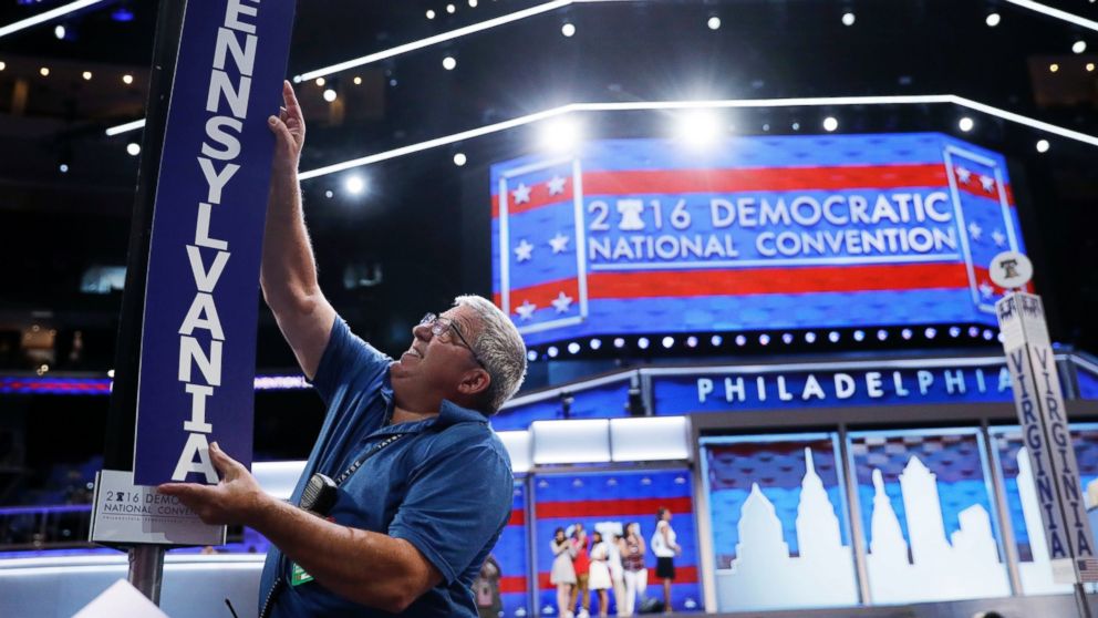 Jimmy Wright installs the Pennsylvania delegation placard ahead of the 2016 Democratic National Convention in Philadelphia, July 24, 2016. 
