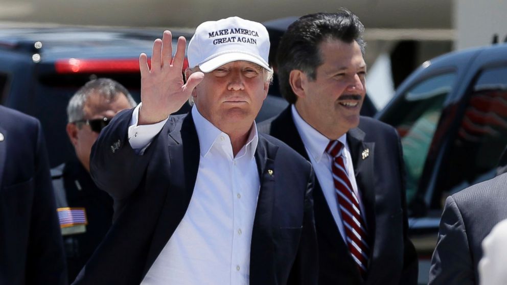 Republican presidential hopeful Donald Trump waves after arriving at the airport for a visit to the U.S. Mexico border in Laredo, Texas, July 23, 2015. 