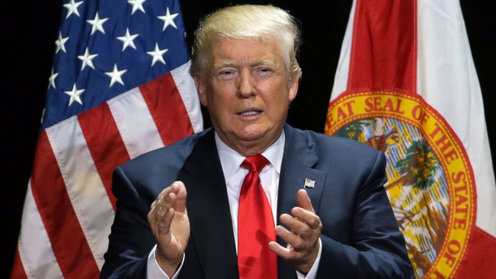 Republican presidential candidate Donald Trump claps during a campaign speech, June 11, 2016, in Tampa, Fla. 