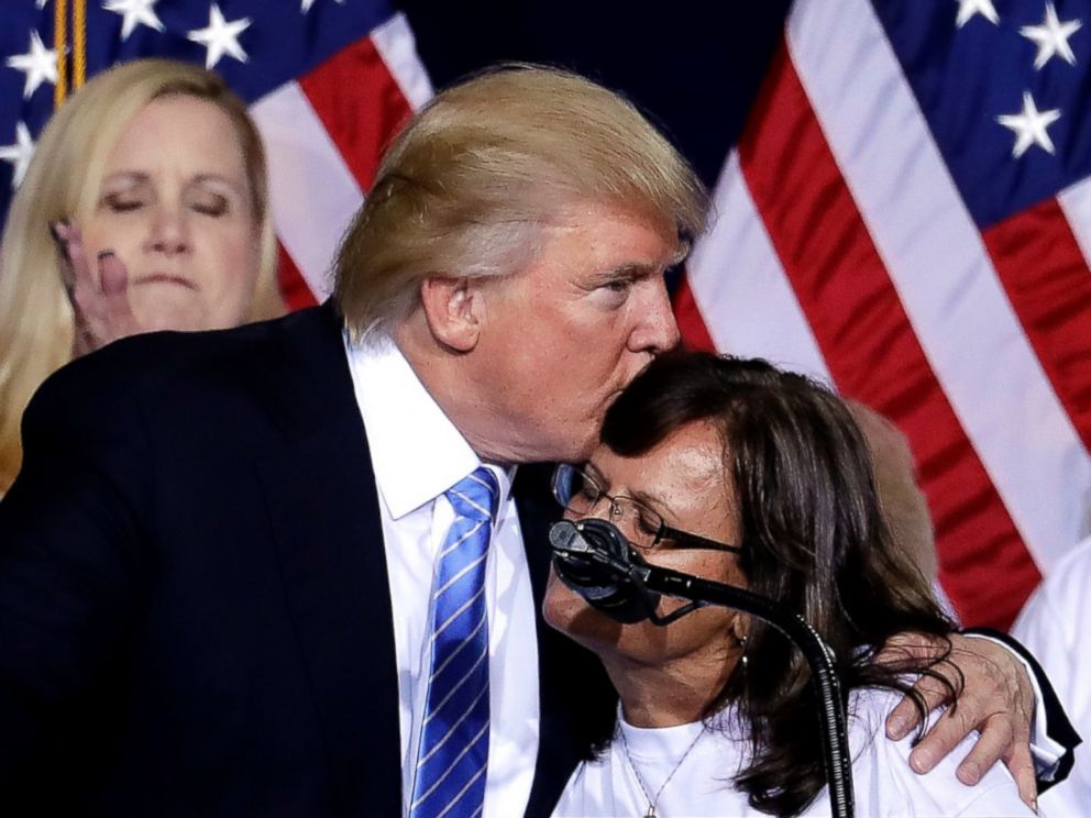 PHOTO: Republican presidential candidate Donald Trump hugs a woman, after delivering an immigration policy speech during a campaign rally at the Phoenix Convention Center, Aug. 31, 2016, in Phoenix. 
