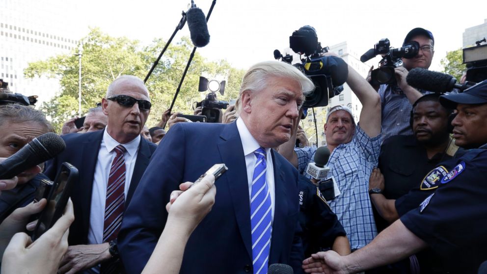 PHOTO: Republican presidential candidate Donald Trump is surrounded by media as he arrives for jury duty in New York, Aug. 17, 2015. 