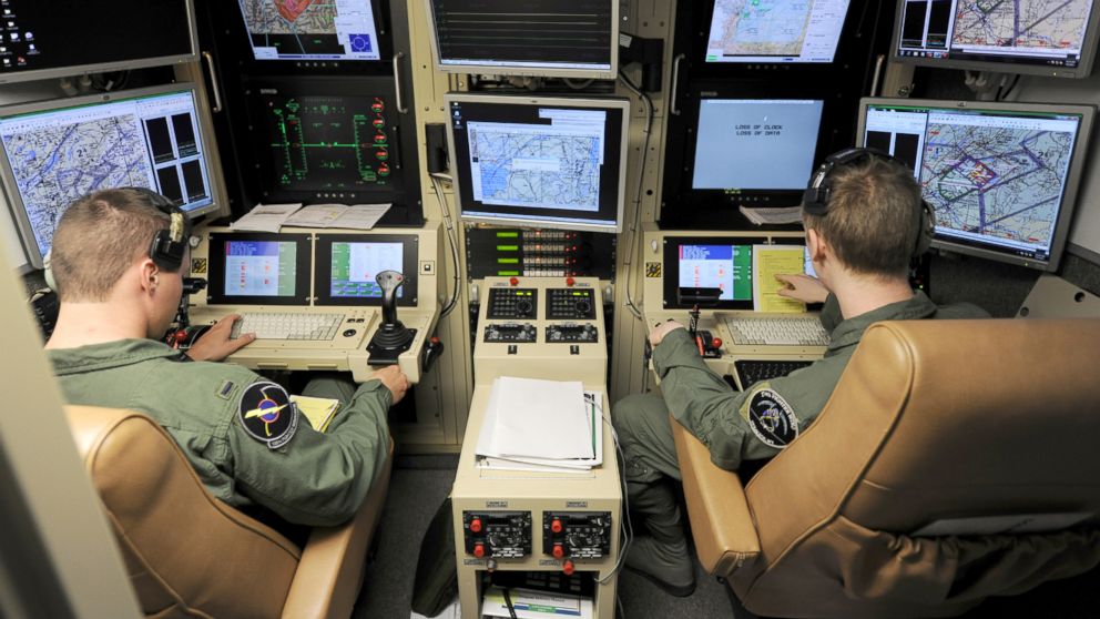 A student pilot and sensor operator man the controls of a MQ-9 Reaper in a ground-based cockpit during a training mission flown from Hancock Field Air National Guard Base, Syracuse, New York, June 6, 2012.