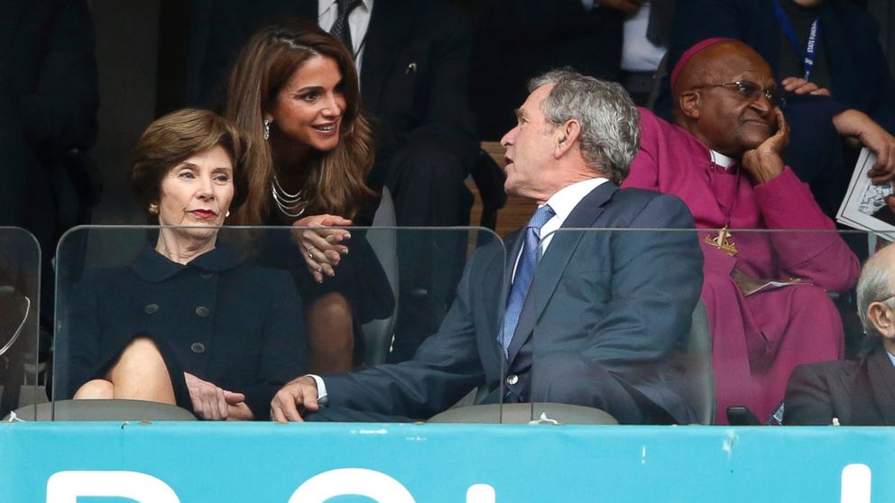 PHOTO: Jordan's Queen Rania, center, speaks with Former U.S. President George W. Bush and his wife Laura during the memorial service for former South African president Nelson Mandela at the FNB Stadium in Soweto near Johannesburg, Dec. 10, 2013.