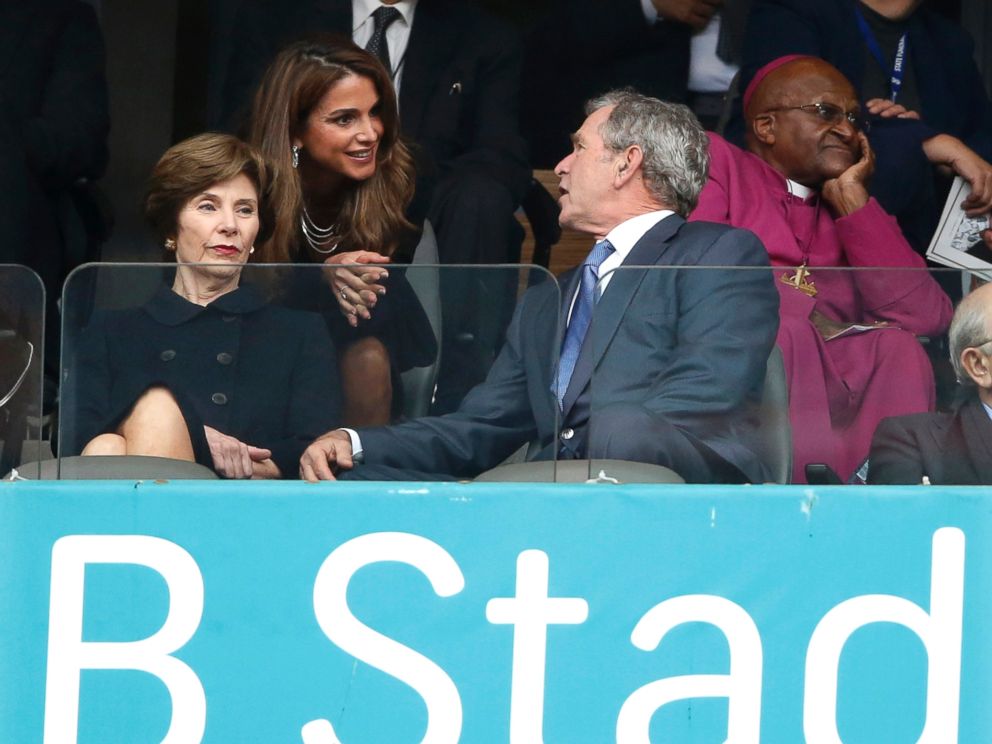 PHOTO: Jordans Queen Rania, center, speaks with Former U.S. President George W. Bush and his wife Laura during the memorial service for former South African president Nelson Mandela at the FNB Stadium in Soweto near Johannesburg, Dec. 10, 2013.