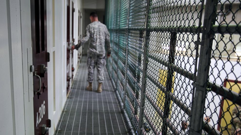 PHOTO: An Army captain walks outside unoccupied detainee cells inside Camp 6 at the U.S. detention center at Guantanamo Bay, Cuba, Feb. 6, 2016. 