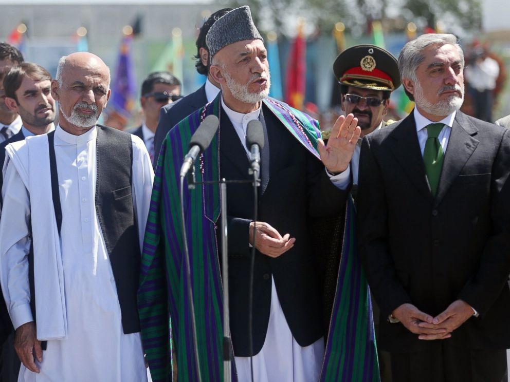 PHOTO: Afghan President Hamid Karzai, center, speaks in front of local and international media representatives during the Independence Day ceremony in Kabul, Afghanistan, Aug. 19, 2014. 