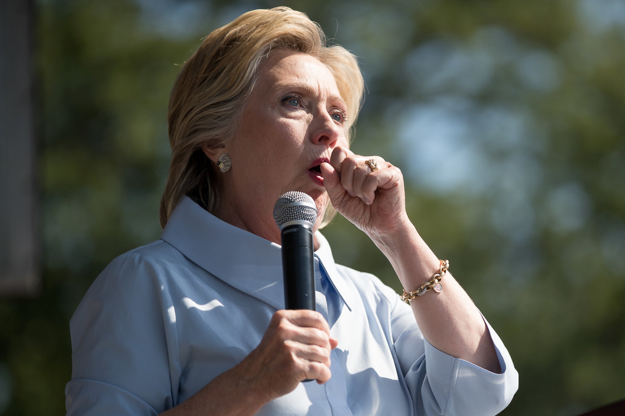 PHOTO: Democratic presidential candidate Hillary Clinton stops her speech to cough at the 11th Congressional District Labor Day festival at Luke Easter Park in Cleveland, Sept. 5, 2016.