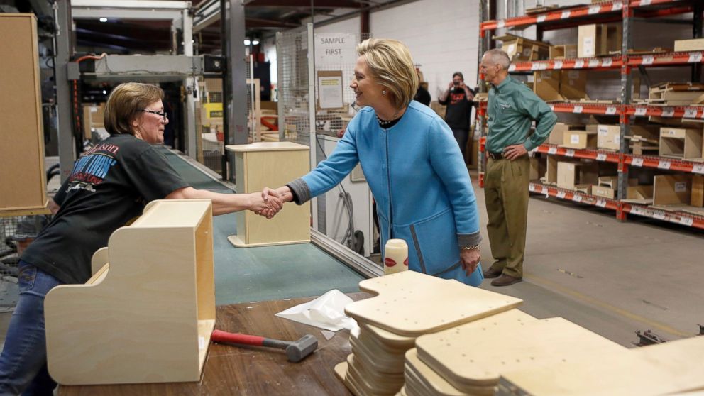 Democratic presidential candidate Hillary Rodham Clinton shakes hands with Amy Alexander during a factory tour at Whitney Brothers Inc., April 20, 2015, in Keene, N.H.