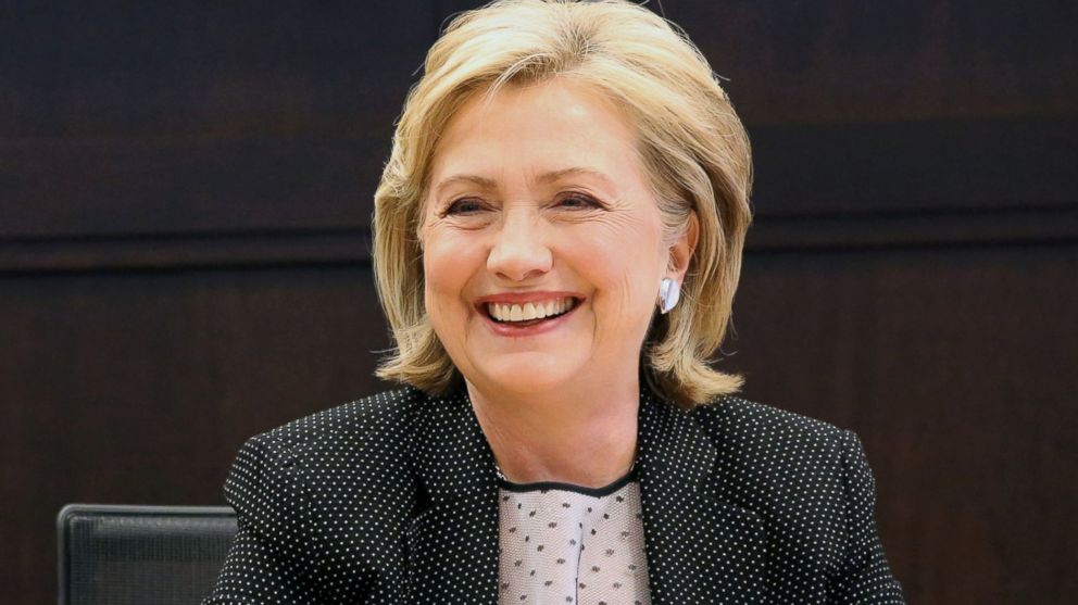 Former Secretary of State Hillary Rodham Clinton smiles as she signs copies of her new book "Hard Choices," her recounting of her time as President Barack Obama's top diplomat, at a book signing event at Barnes & Noble at The Grove in Los Angeles, Calif., June 19, 2014. 