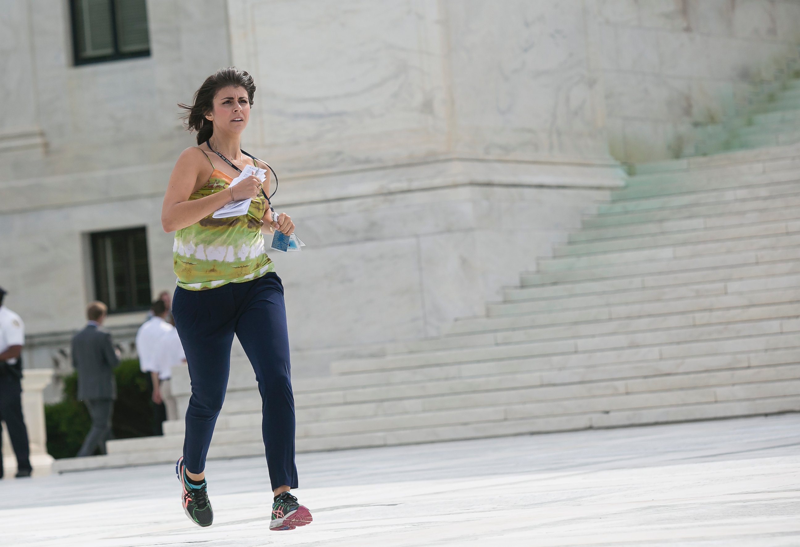 PHOTO: Members of the news media, including interns for network television stations, run with decisions in hand on the opinion for health care in Washington, June 25, 2015, in an official tradition referred to as the "running of the interns.