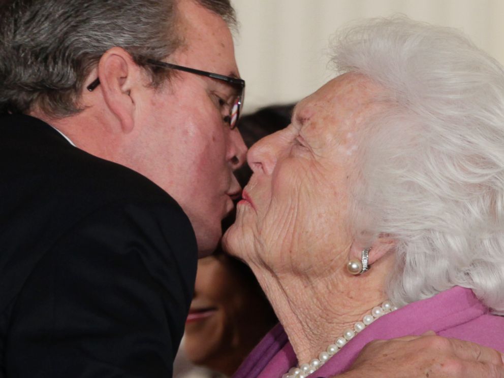 PHOTO: Former first lady Barbara Bush, right, greets her son former Fla. Gov. Jeb Bush, with a kiss as she arrives at the 2010 Presidential Medal of Freedom ceremony, in this Feb. 15, 2011, file photo.