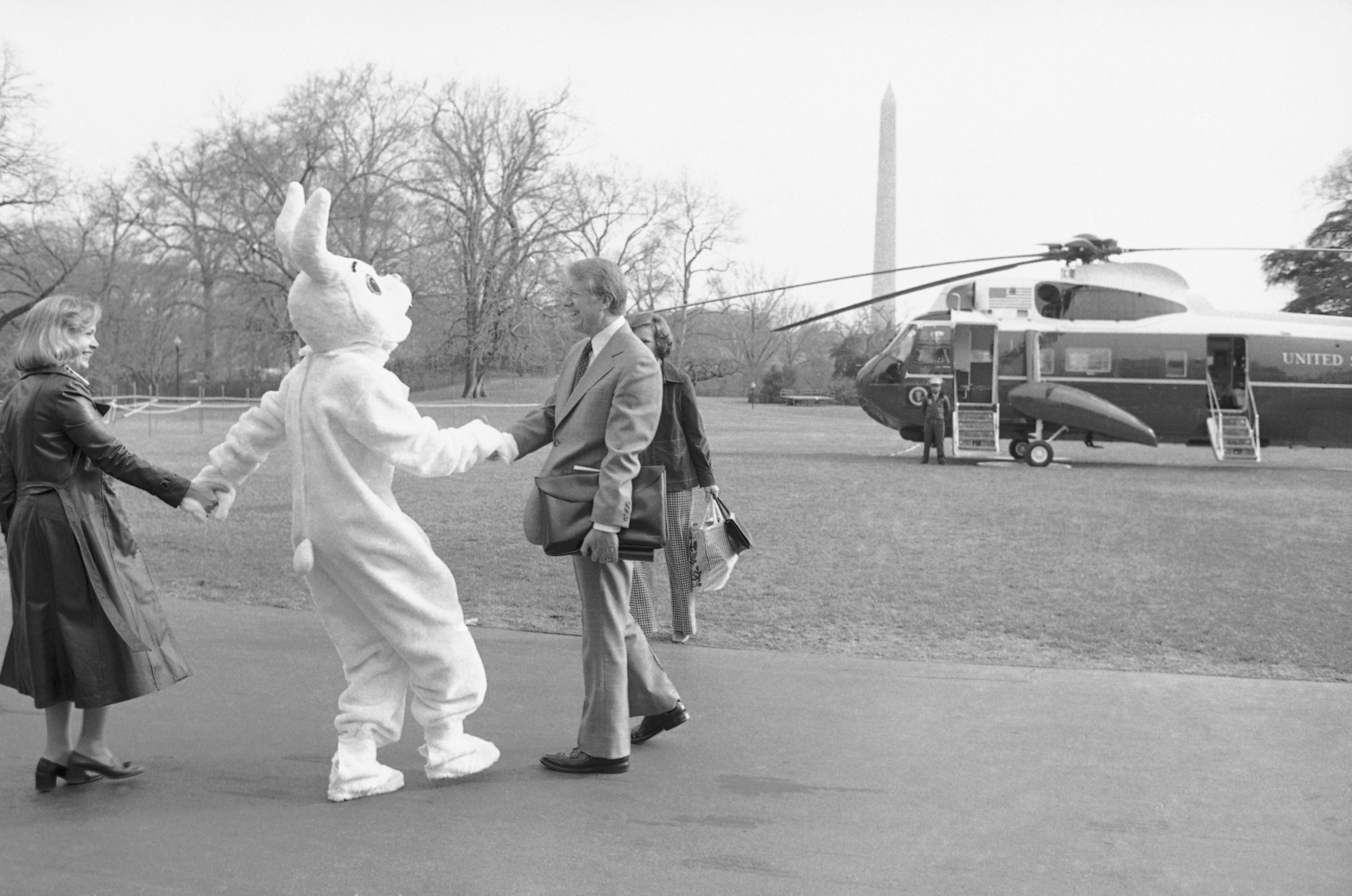 PHOTO: As President Jimmy Carter and first lady Rosalynn Carter were leaving the White House for a week-end at Camp David, the Easter bunny jumped out of the bushes on South Lawn and greeted them in Washington, March 24, 1978.