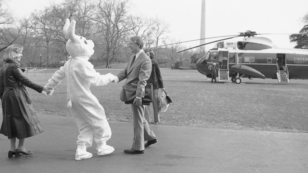 PHOTO: As President Jimmy Carter and first lady Rosalynn Carter were leaving the White House for a week-end at Camp David, the Easter bunny jumped out of the bushes on South Lawn and greeted them in Washington, March 24, 1978.