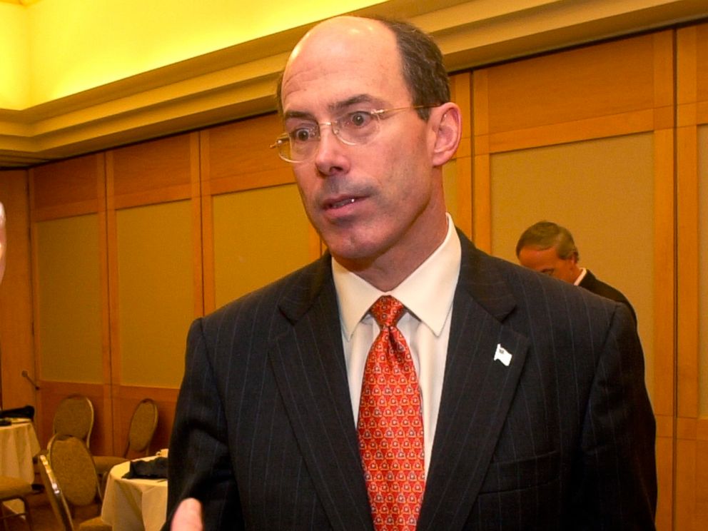 PHOTO: Joseph E. Schmitz, Inspector General of the U.S. Department of Defense, listens to criticism after speaking at the Cleveland City Club, in Cleveland, June 25, 2004.