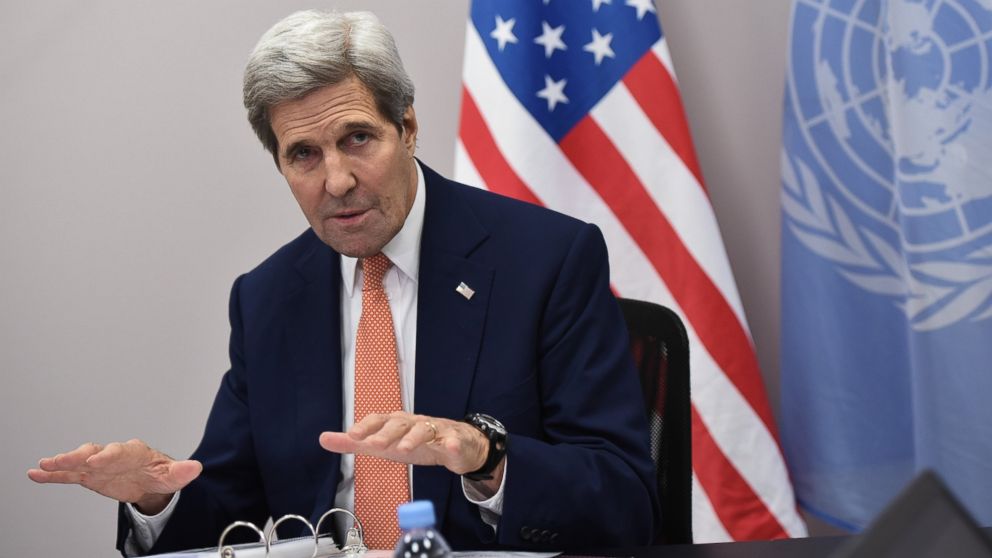 Secretary of State John Kerry speaks to the traveling press following the COP21 United Nations conference on climate change in Le Bourget, near Paris, Dec. 12, 2015. 