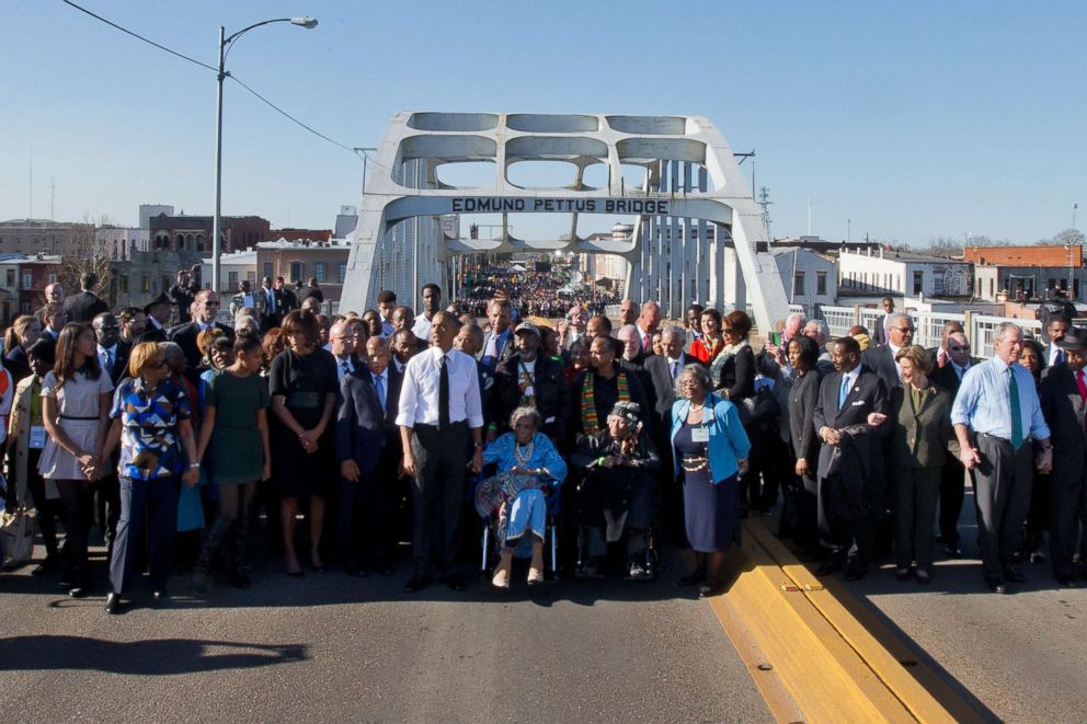 PHOTO: President Barack Obama, first lady Michelle Obama, Malia and Sasha as well as members of Congress and civil rights leaders make a symbolic walk across the Edmund Pettus Bridge, March 7, 2015, in Selma, Ala. 